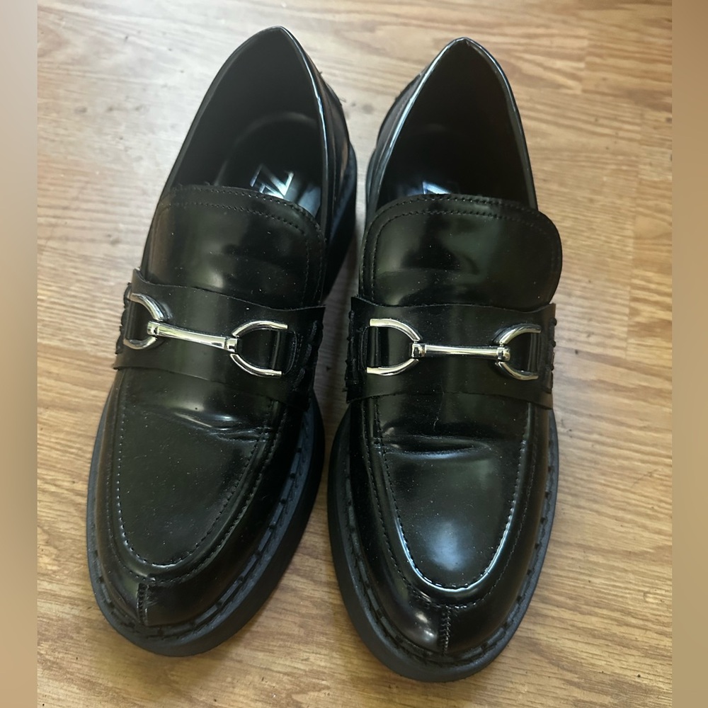 Black Loafers with Silver Detailing